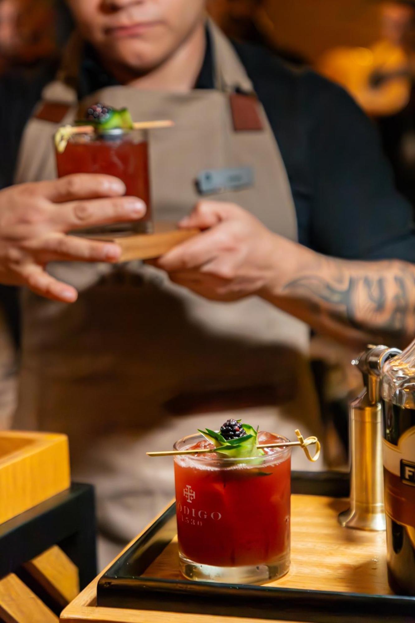 Hyatt Regency Andares Guadalajara Otel Zapopan Dış mekan fotoğraf A bartender using a cocktail paddle to garnish a drink
